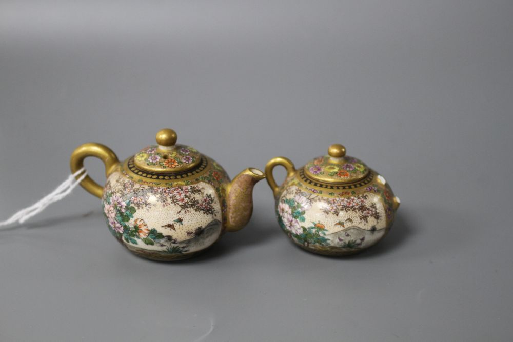 A Satsuma miniature teapot and matching sugar bowl, decorated with geisha in gardens, teapot length 7.5cm height 4.5cm